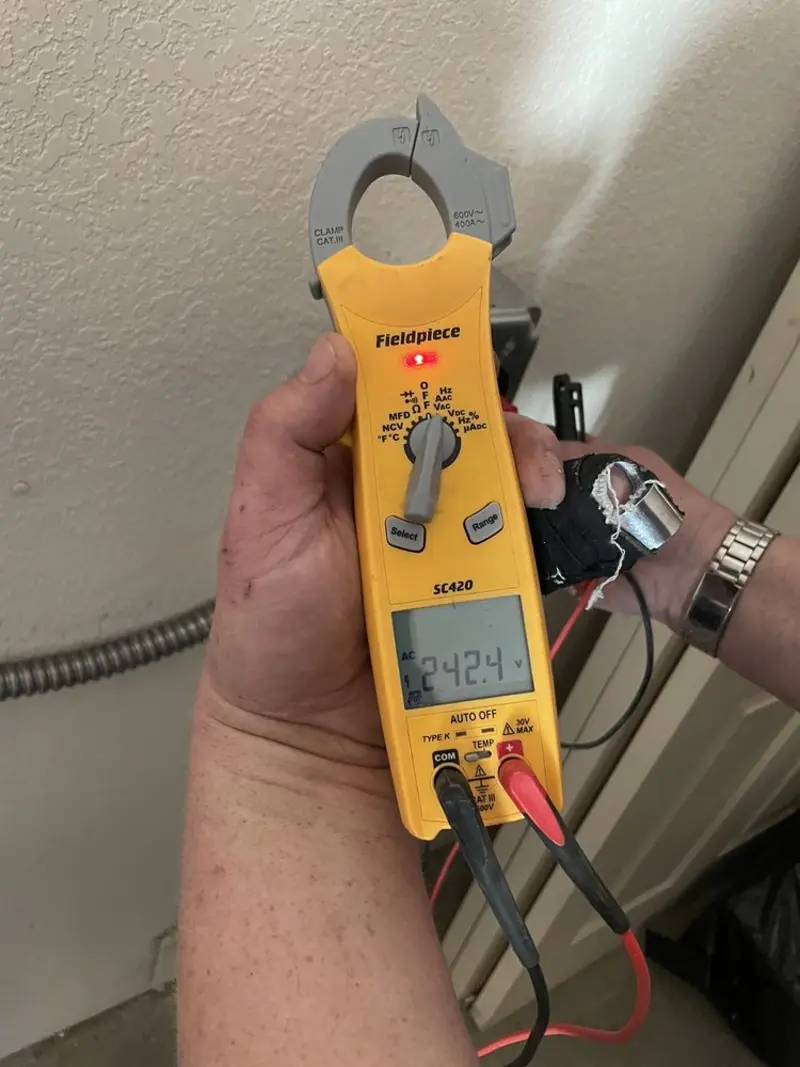 Voltage testing with clamp meter during Circuit Breaker Repair in Reston